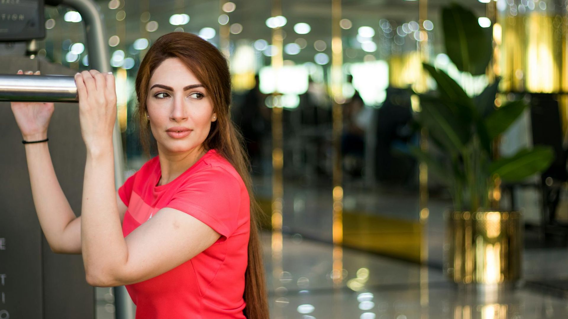 A blurred background of a modern sunlit gym interior