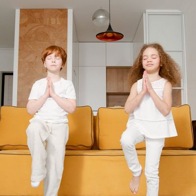 Person doing a balance pose in a bright room